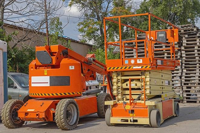 warehouse forklift lifting cargo onto shelves in Karnack