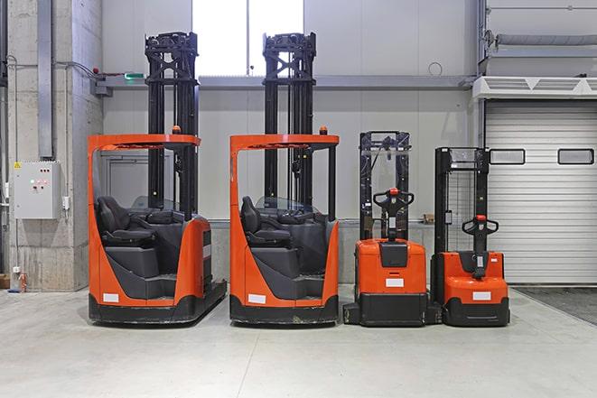 industrial forklifts lifting and transporting heavy materials